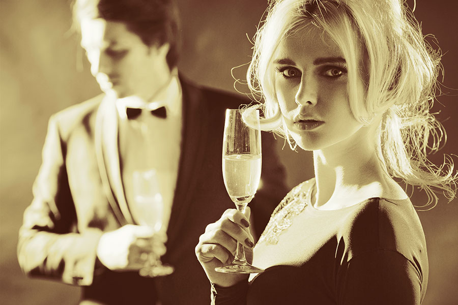 Photo of a woman drinking champagne at a formal