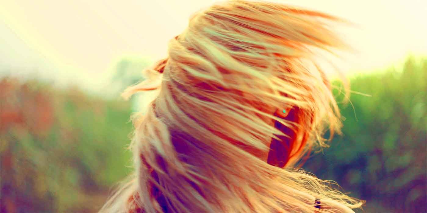 Photo of someone's hair blowing in the wind