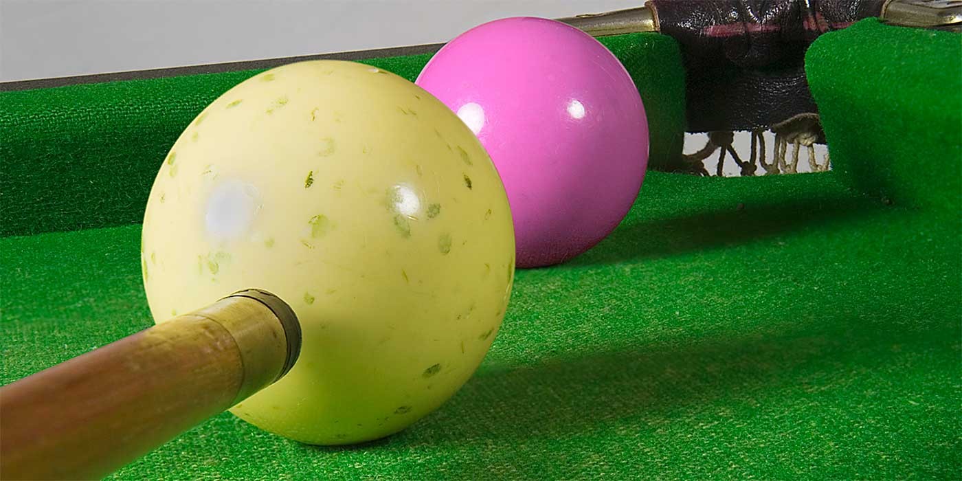 Photo of a pink snooker ball being potted