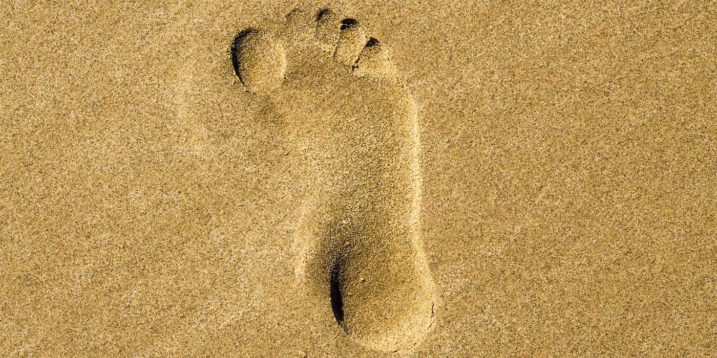 Photo of a footprint in the sand