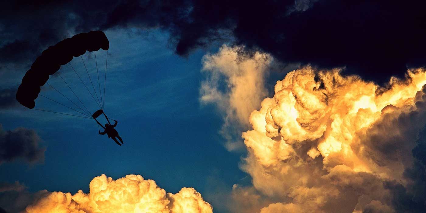 Photo of a parachutist in the sky