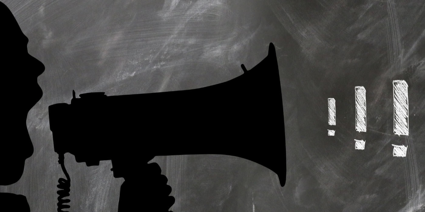 Picture of a man shouting into a megaphone