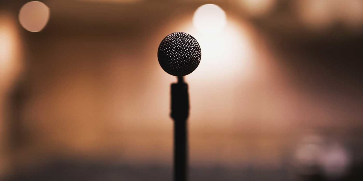 Photo of a microphone on a stage