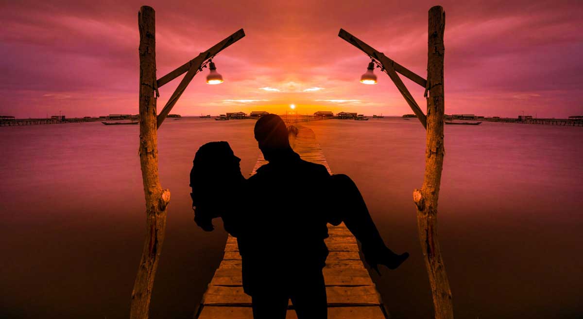 Photo of a honeymoon couple at sunset