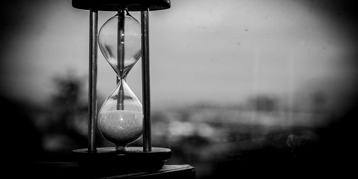 Photo of an hourglass showing time elapsing