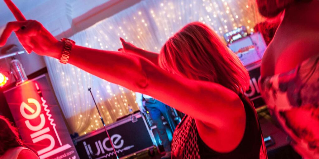 Photo of somebody with their hands in the air with Juice Wedding Band Northern Ireland NI