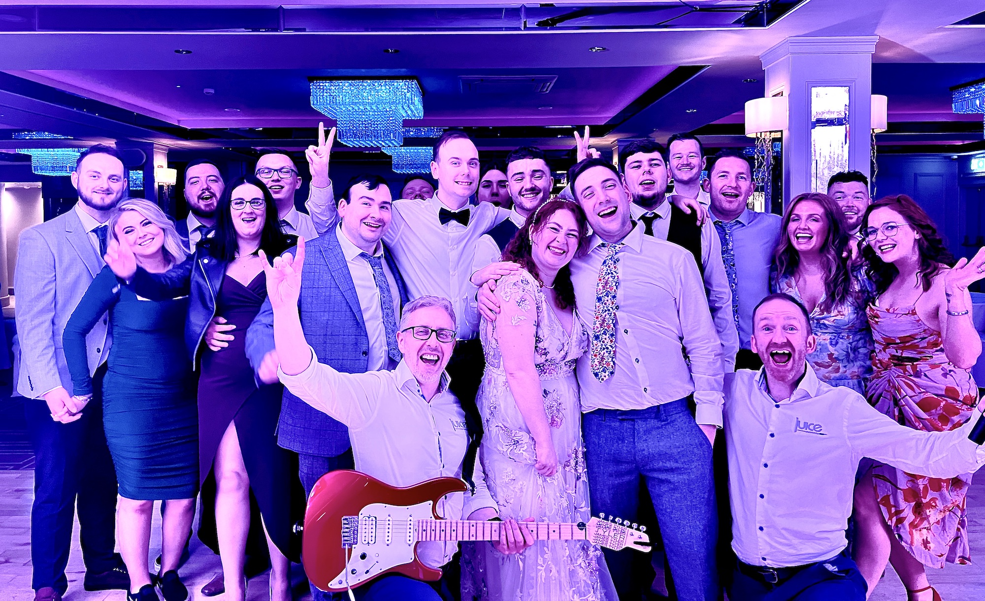 Photo of Lydia and Max with their wedding guests and Rod and Neil from Juice Wedding Band Northern Ireland NI