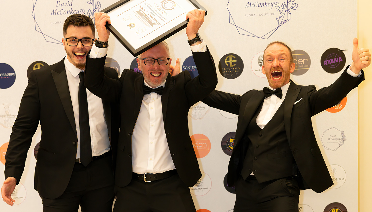 Photo of Rod, Neil and Curtis from Juice Wedding Band Northern Ireland with their prize from the NI Wedding Awards 2024